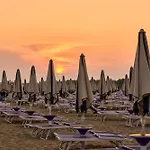 Garden With Pool In Village Bibione