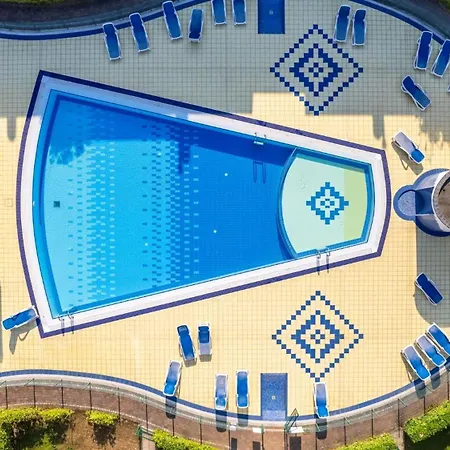 Garden With Pool In Village Bibione